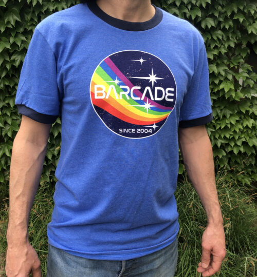 T-shirt with Barcade Printed on it and a Rainbow in Space Graphic