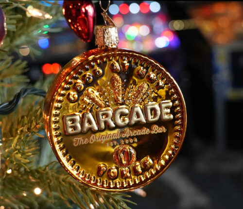 Holiday Tree Ornament that looks like a Barcade token