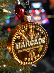 Holiday Tree Ornament that looks like a Barcade Token